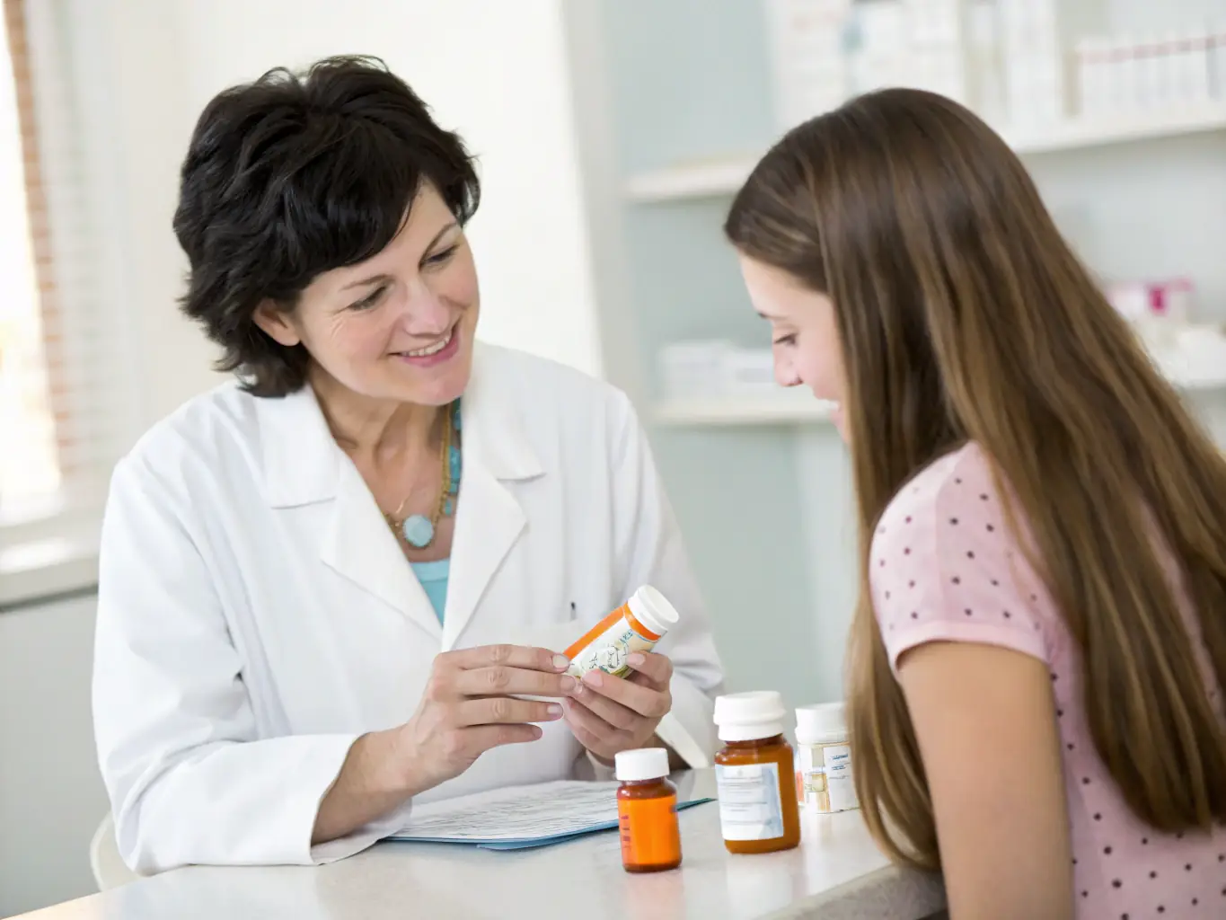 An image of a pharmacist in a South African pharmacy, assisting a patient with their medication, highlighting the importance of accurate drug information.